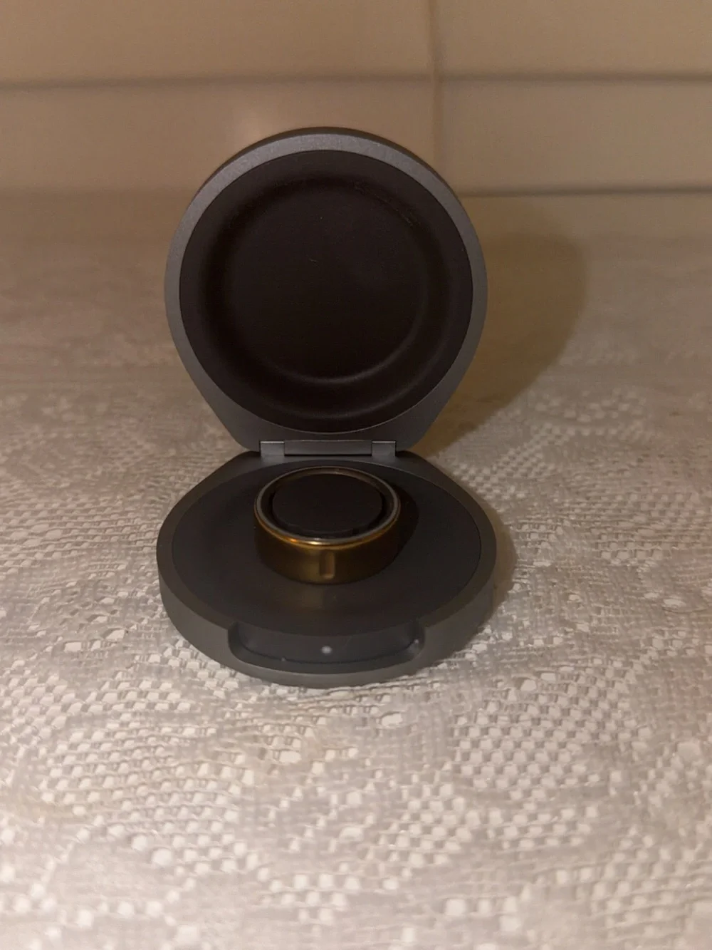 Oura Ring in Gold with Gray Charging Case